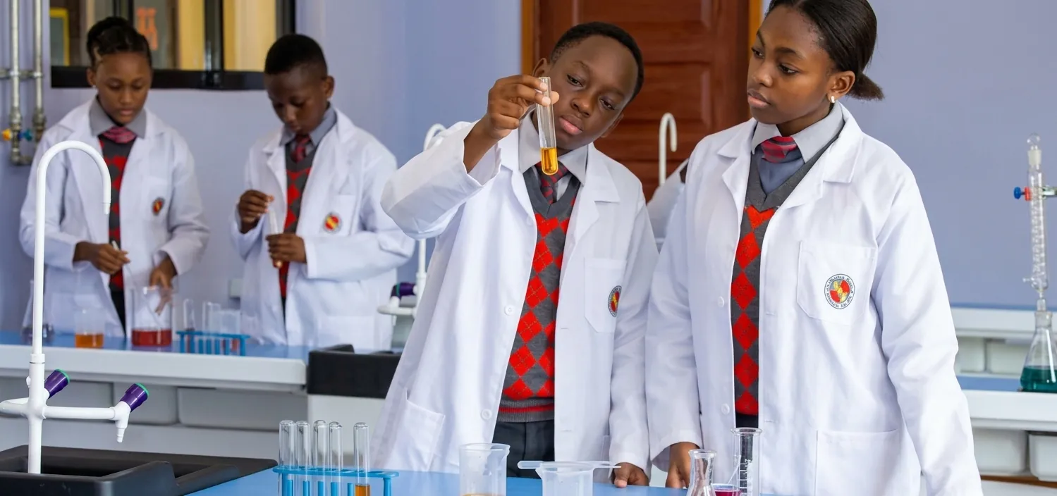 Students carrying out a science experiment in a school laboratory